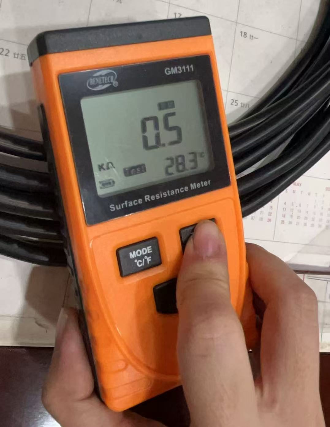 Surface resistance meter reading on a cable sample